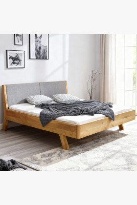 Massivholzbett Eiche 180x200 cm mit grauem Stoffkopfteil